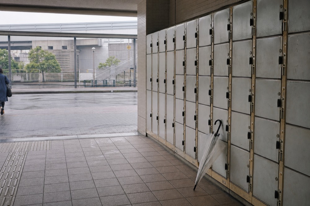 Rows of coin lockers along a wall near a building entrance