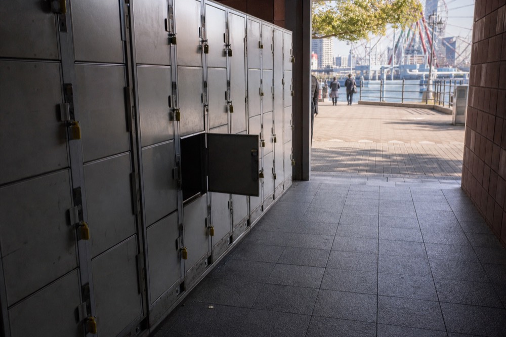 Row of coin lockers along a corridor near an attraction entrance