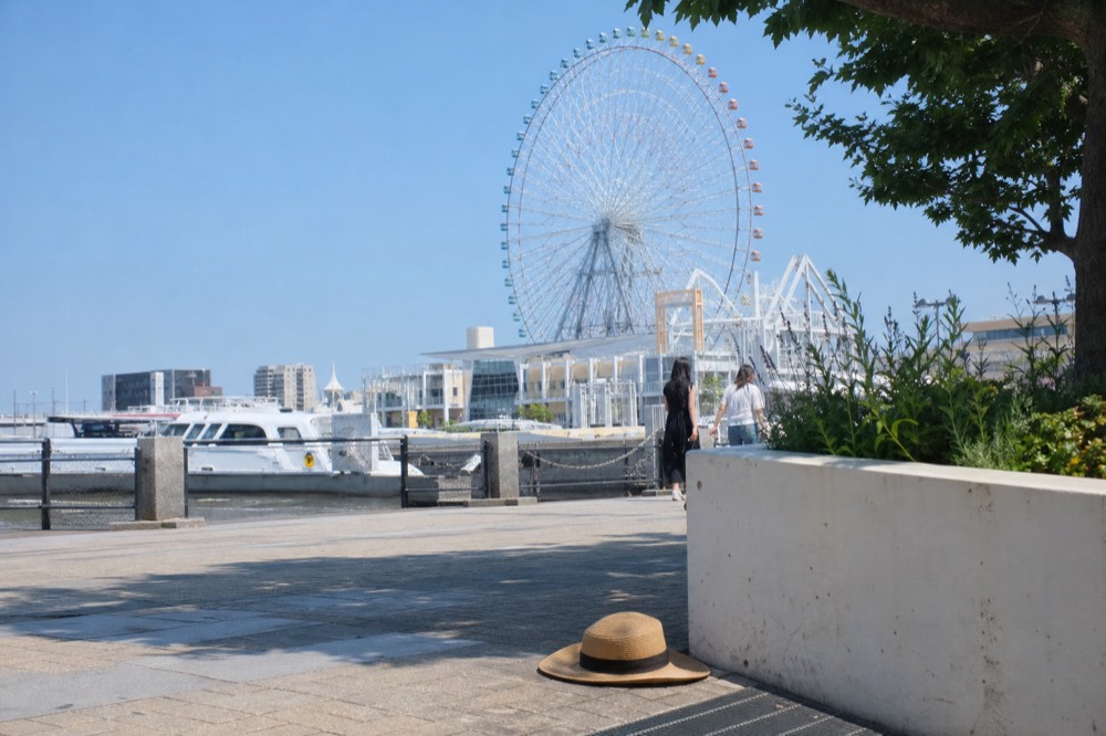Tempozan Giant Ferris Wheel with colorful cabins and blue sky
