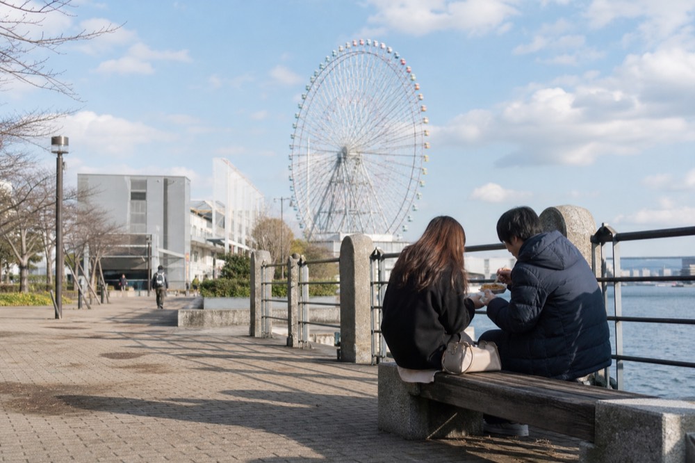 Waterfront promenade at Tempozan Harbor Village with the Ferris wheel in the background