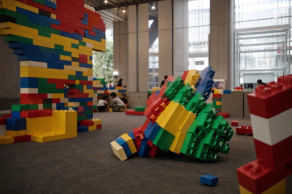 Colorful indoor play attraction with building-block themed displays